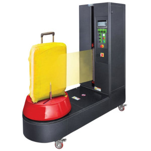 https://www.techni-contact.site/ressources/images/produits/merchandising/banderoleuse-a-bagages-semi-automatique-97682141-1.jpg - Emballage de valises avec du film étirable