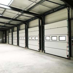 https://www.techni-contact.site/ressources/images/produits/merchandising/porte-sectionnelle-esthetique-12452159-1.jpg - Système d’ouverture et de fermeture ergonomique