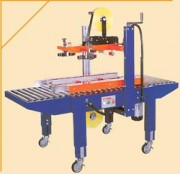 Machine à fermer les cartons