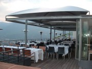 Abri terrasse restaurant à toile aérée