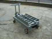 Système de changement de batteries pour grues de levage